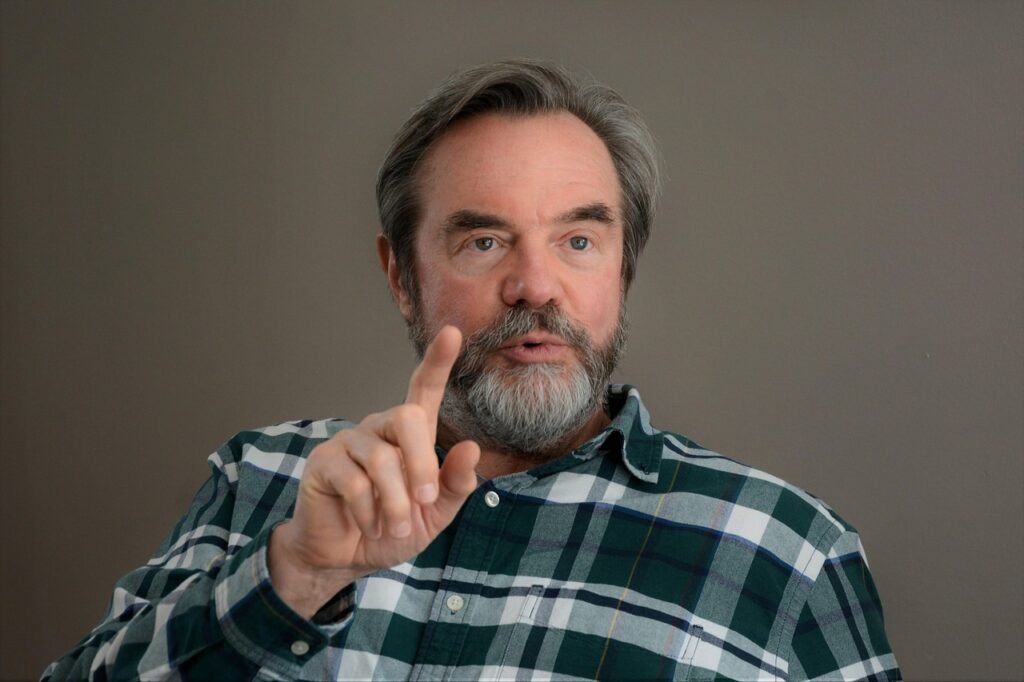 counselor, wellness coach, man, pointing, beard, green eyes, speaker, lecturer, teacher, professor, coaching, business, teach, office, visit, expert, witness, expert witness, plaid shirt, seminar, presentation, manager, brown business, brown office, brown wellness, brown company, brown presentation, brown management, counselor, speaker, teacher, teacher, teacher, teacher, professor, professor, professor, professor, professor, expert, expert, witness